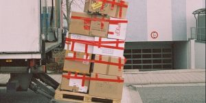 Image of moving company carrying boxes